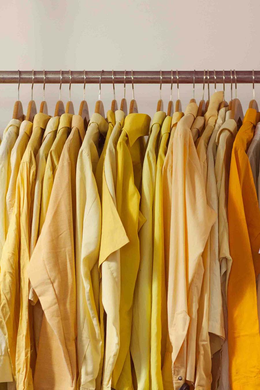 a picture of hanging orange shirts